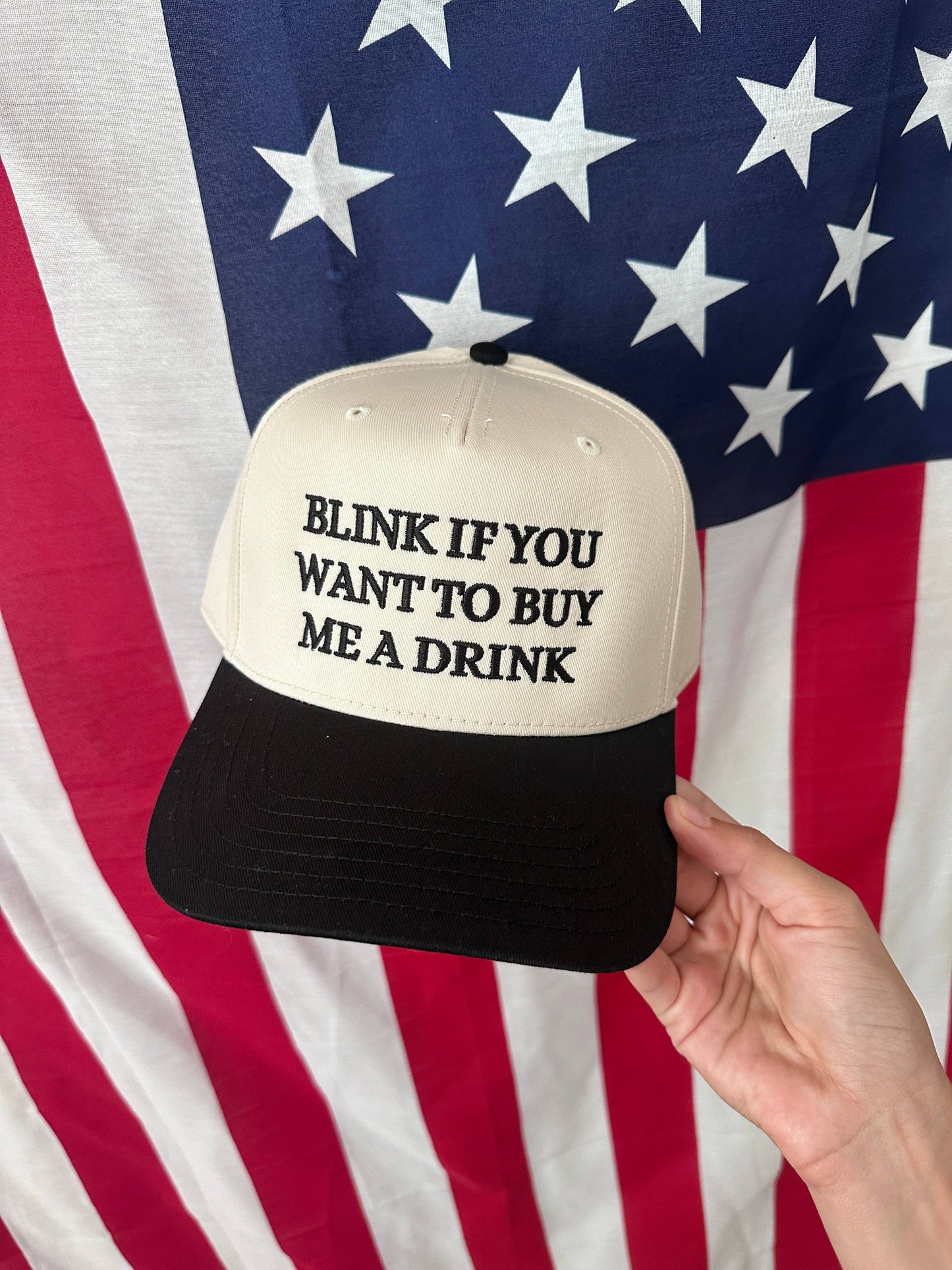 Blink if you want to buy me a drink hat