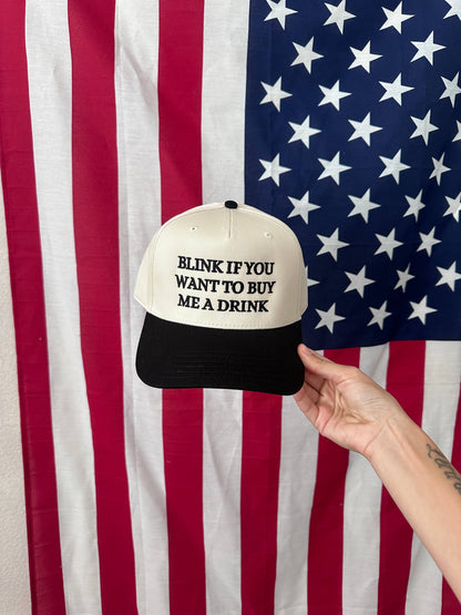 Blink if you want to buy me a drink hat